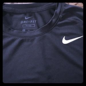 Boys black fitted Dri-fit top by Nike.
